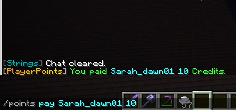 Minecraft chat confirming a 10-Credit transfer to another player